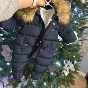 Baby snow suit with fur head.